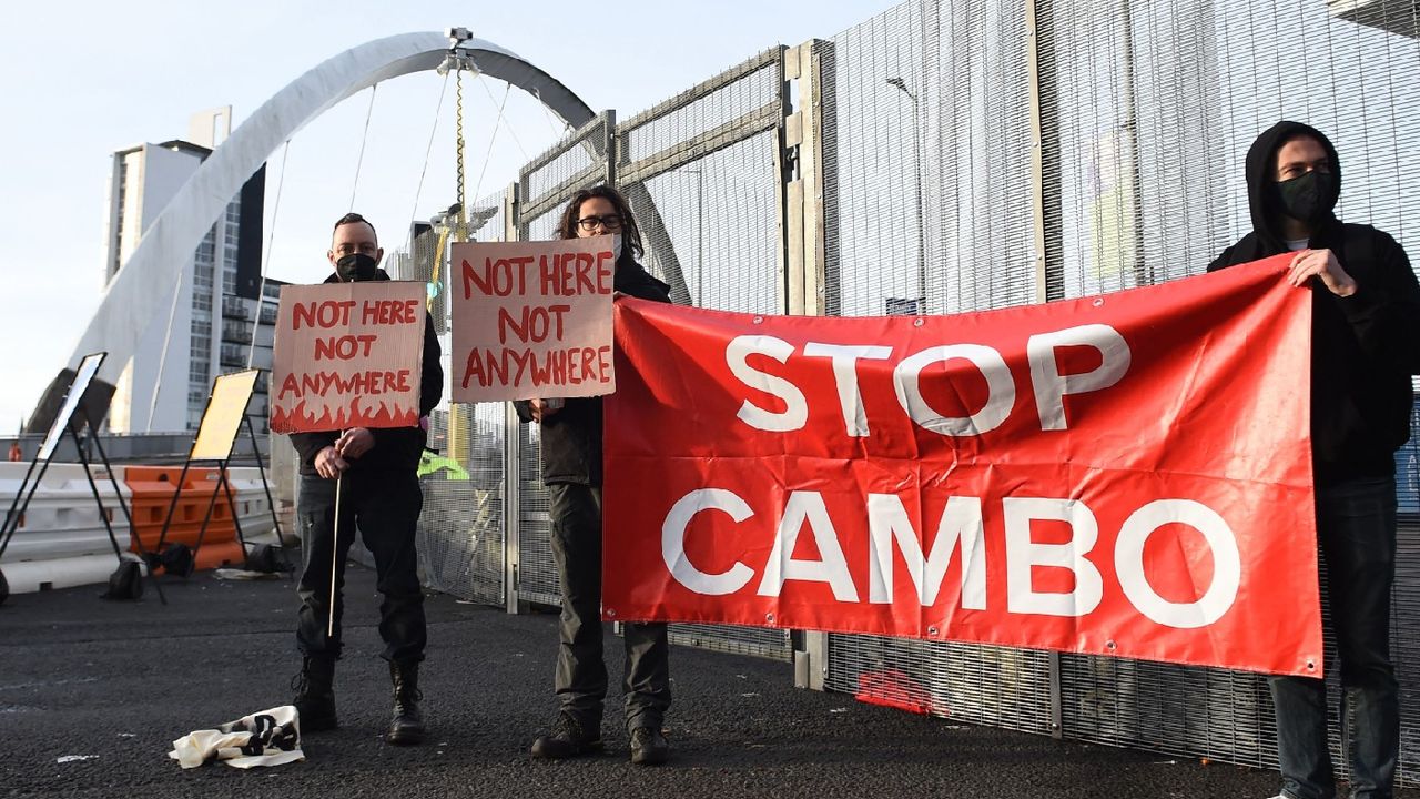 Activists holding sign reading &amp;#039;Stop Cambo&amp;#039;