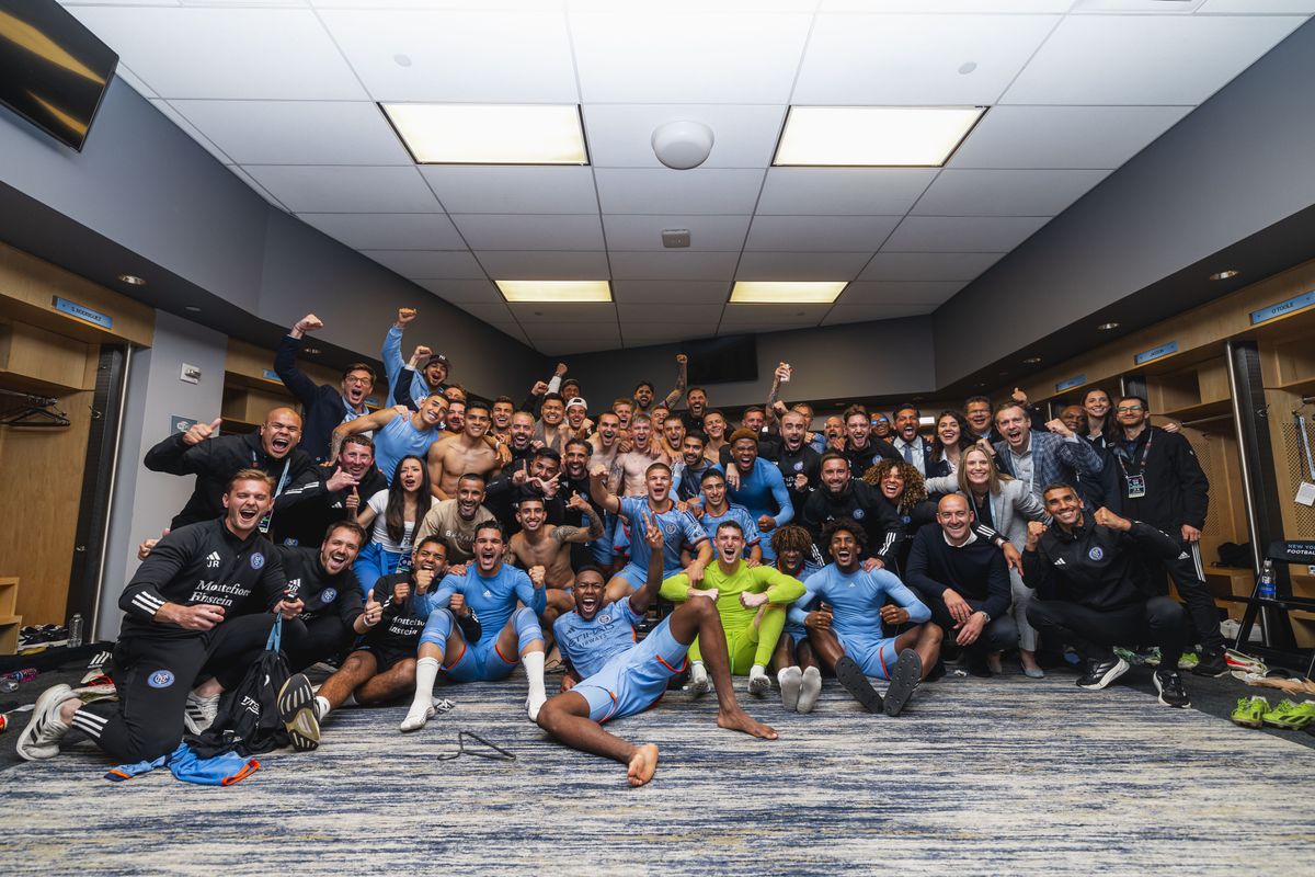 New York City FC celebrating beating New York Red Bulls 2-1 in their dressing room at Citi Field