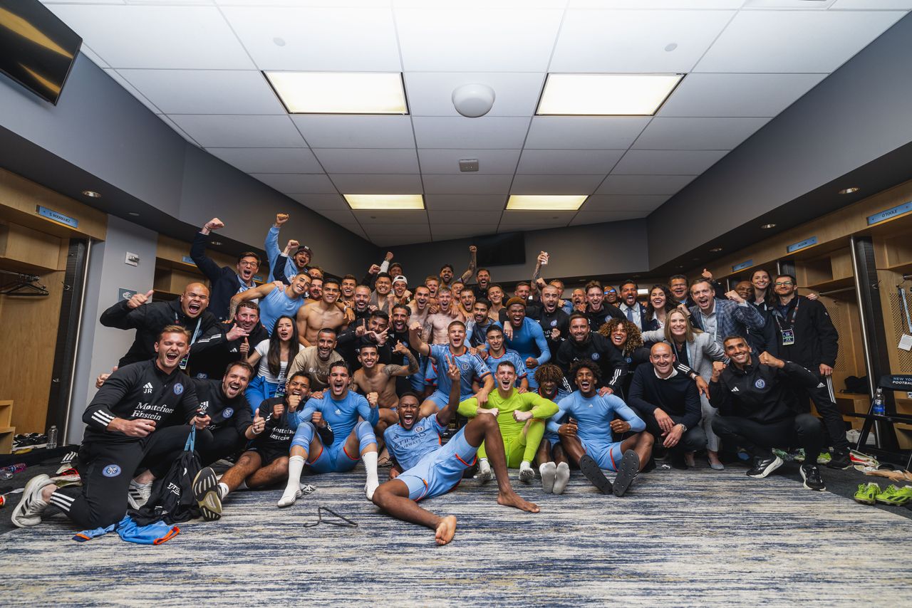New York City FC celebrating beating New York Red Bulls 2-1 in their dressing room at Citi Field