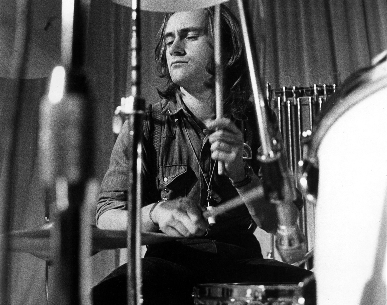 1972: Drummer Phil Collins of the progressive-rock group Genesis records drums in 1972. (Photo by Michael Ochs Archives/Getty Images)