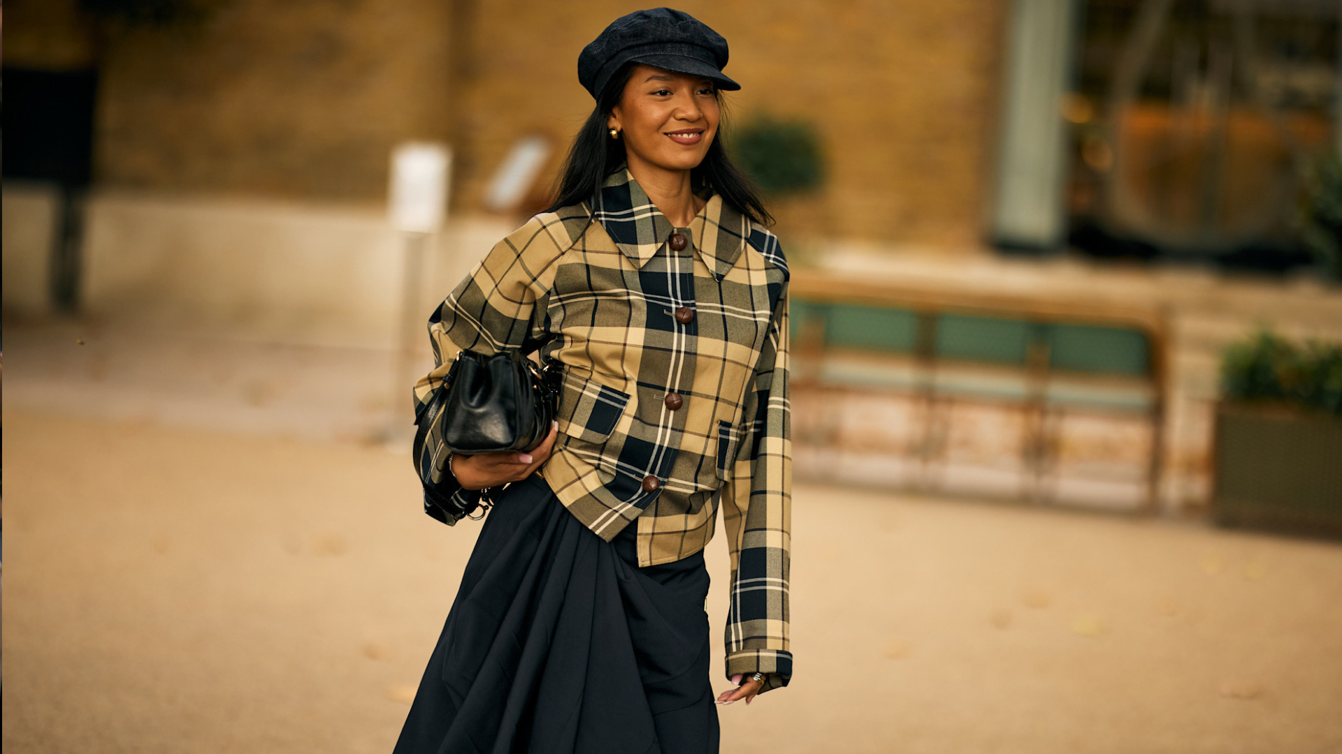 woman wearing a checkered shirt and skirt