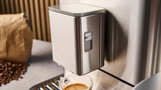 the fully automatic KF8 KitchenAid coffee machine is a stainless steel large coffee machine with a built-in grinder, milk frother, and espresso machine all in one with touchscreen controls