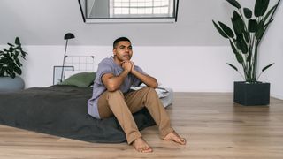 Man sits on blow up mattress