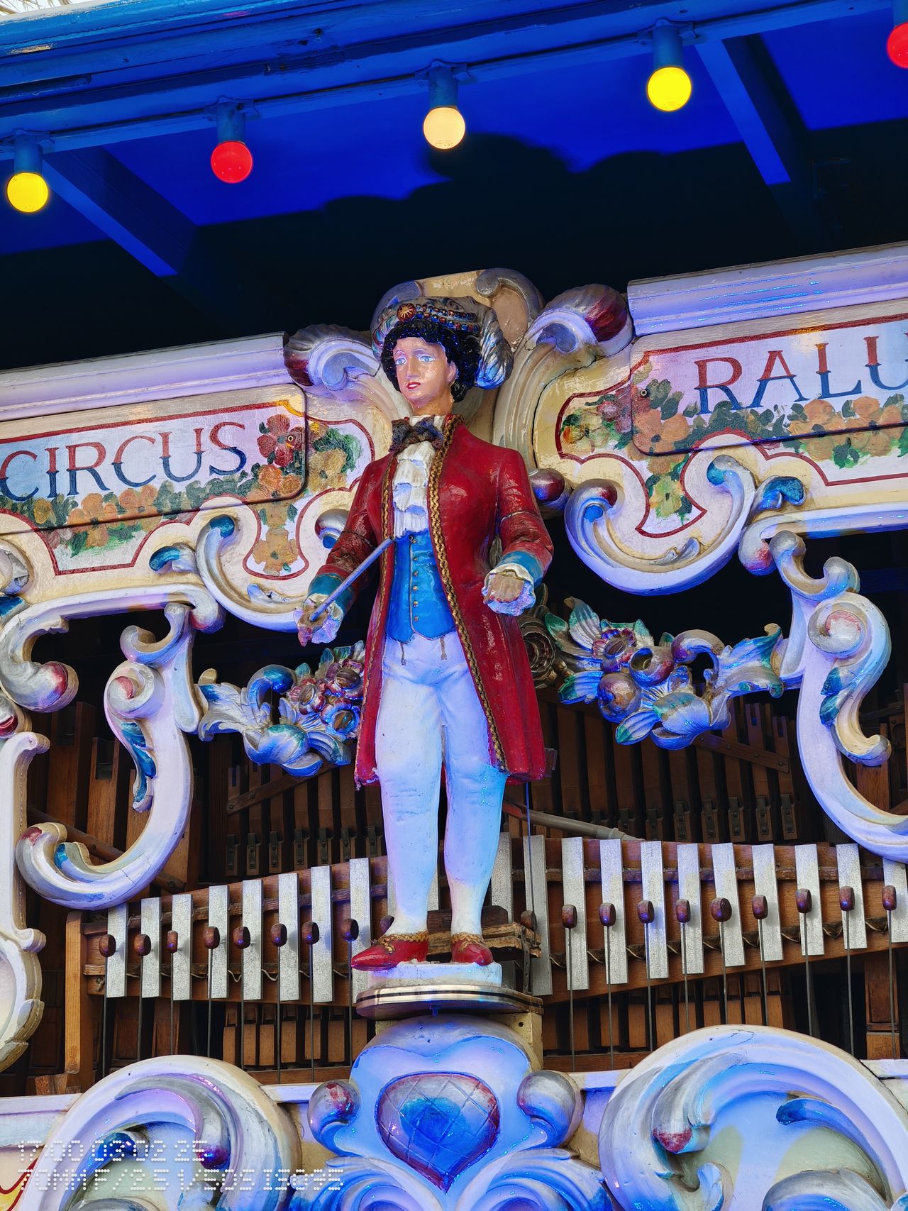 A statue of a band conductor at a circus