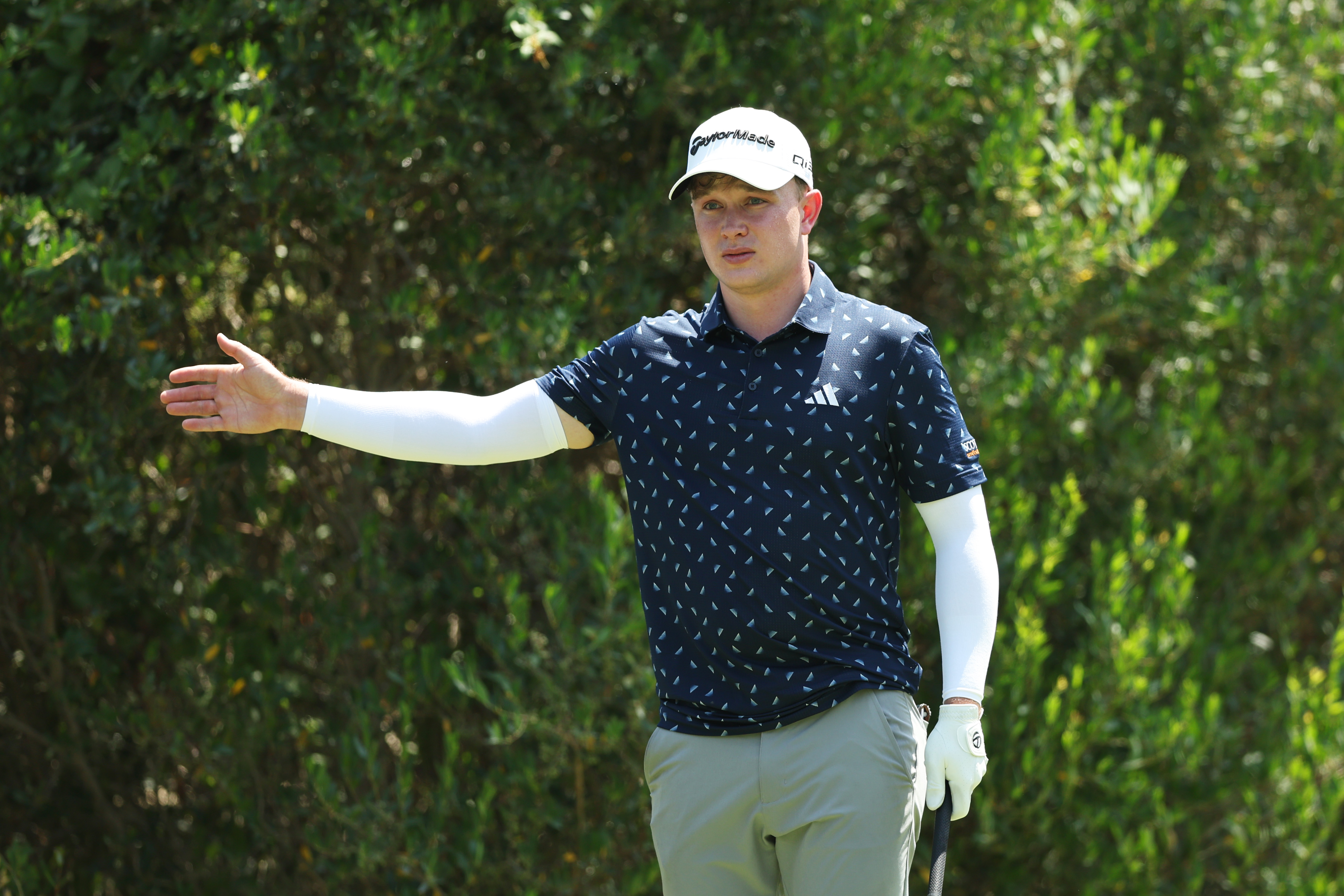 Jayden Schaper stands with his right arm outstretched during the 2025 Italian Open
