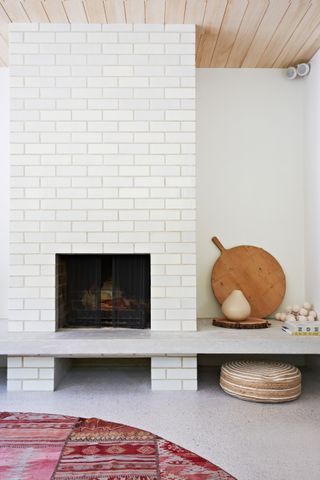 White tiled fireplace in rustic living room