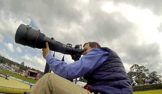 Picture of Sebastian Oakley using his Nikon 600mm f/4 lens at a horse show abroad