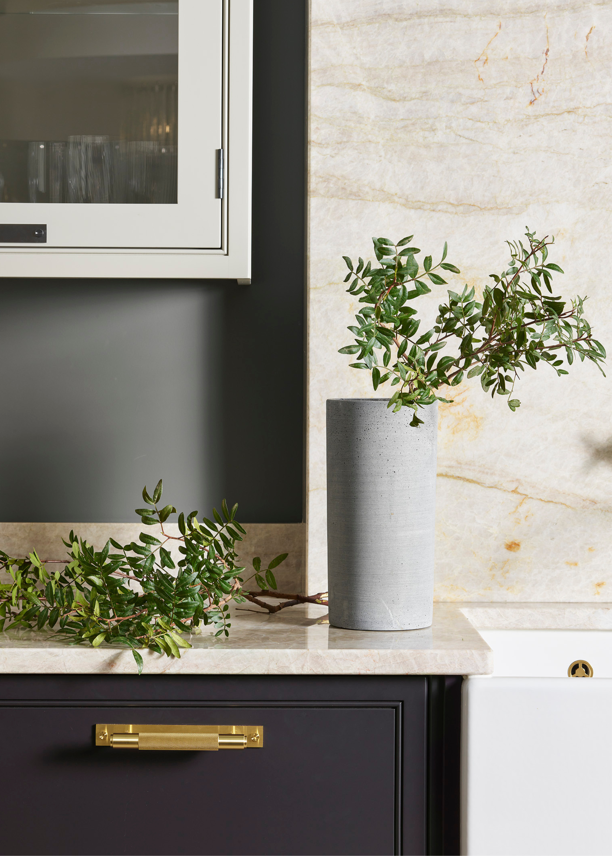 a quartzite worktop and backsplash in a kitchen corner