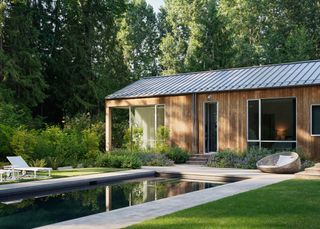 Interurban Residence, a low timber home with minimalist style and light wood tones