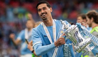 Tijjani Reijnders of Manchester City celebrates with the Emirates FA Cup trophy after his team's victory in the Emirates FA Cup Final against Chelsea on May 16, 2026 in London, England