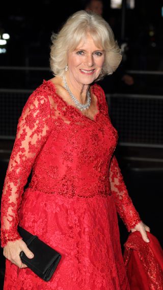 Queen Camilla in a vibrant red dress