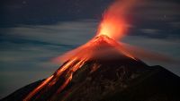 Volcan de Fuego erupting at night.