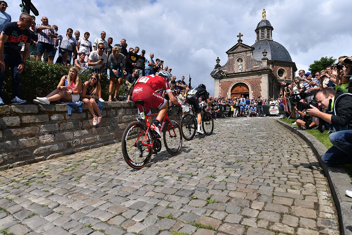 Tony Martin scaling the Muur van Geraardsbergen