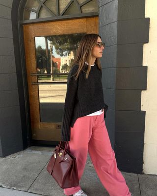 woman wearing pink pants and sweater