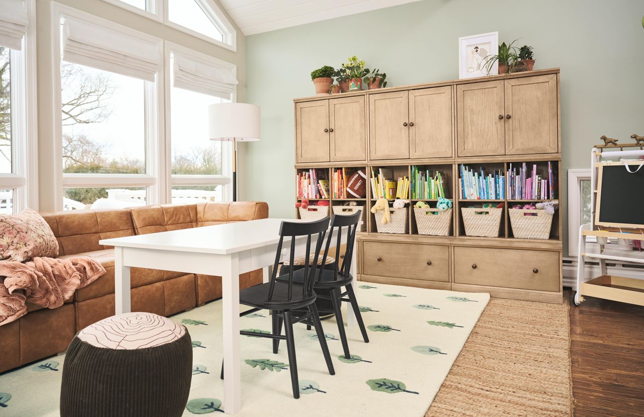 a colorful playroom with big floor to ceiling windows
