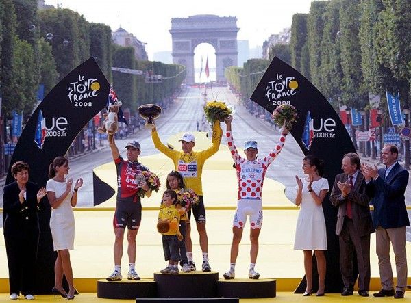 The riders are applauded by Tour chiefs Christian Prudhomme (far right) and Patrice Clerc.