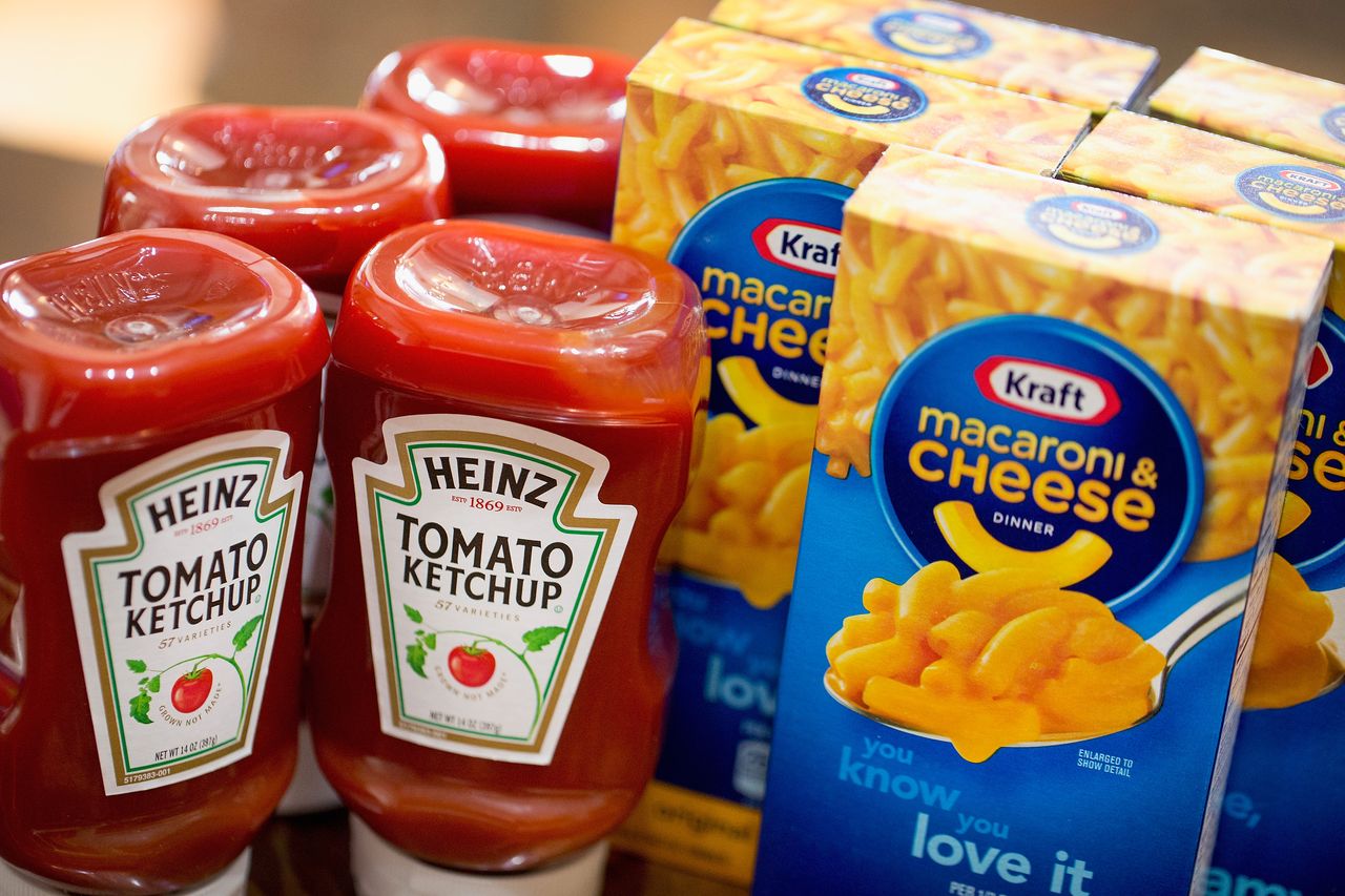 A ketchup bottle alongside some mac and cheese