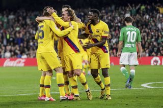 Clement Lenglet is congratulated by Barcelona team-mates at Betis