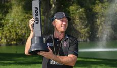 Talor Gooch holds the trophy aloft 