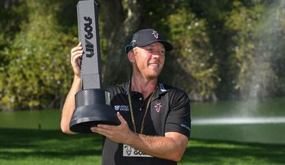 Talor Gooch holds the trophy aloft 