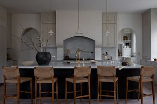 large kitchen with big island and wooden bar stools