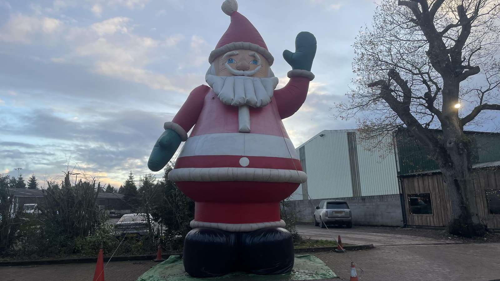 A giant inflatable Santa waving