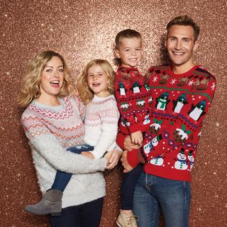 Family wearing Morrisons Christmas jumpers