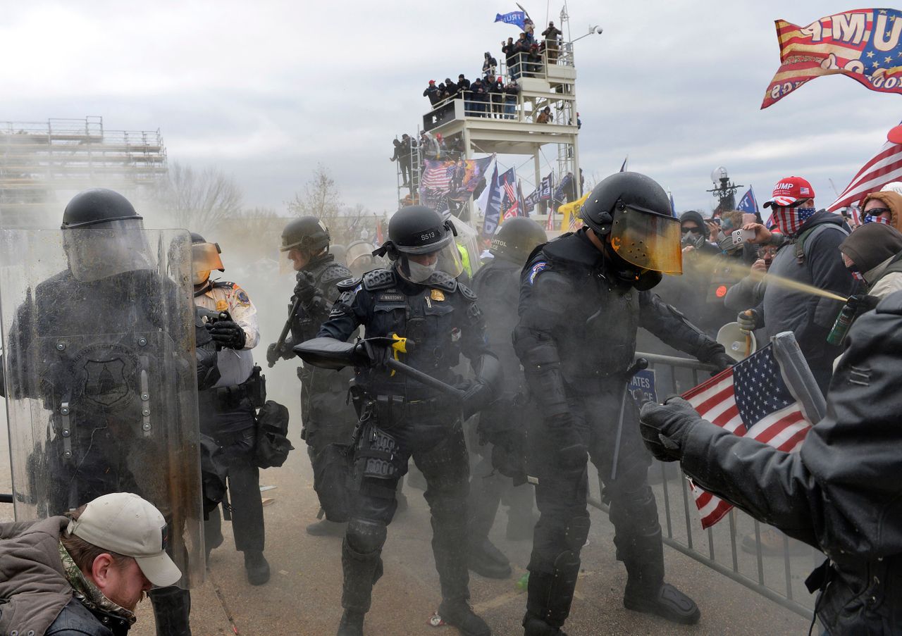 Trump supporters face off with police at the Capitol.