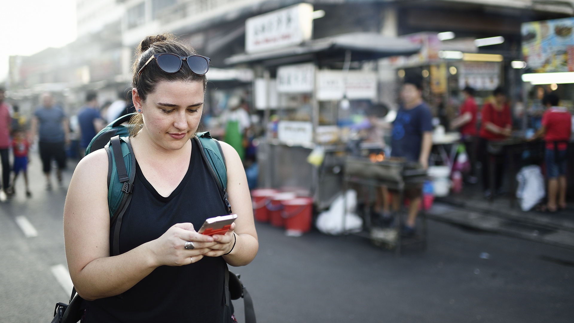 Woman using her smartphone while travelling