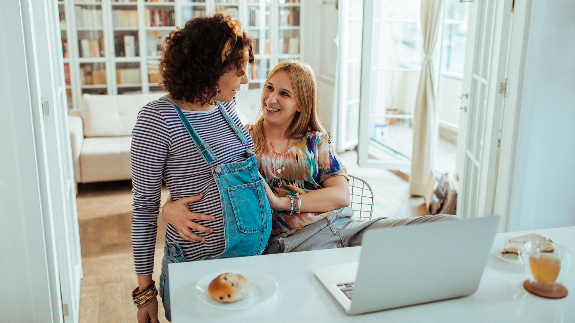 same sex couple celebrating a pregnancy