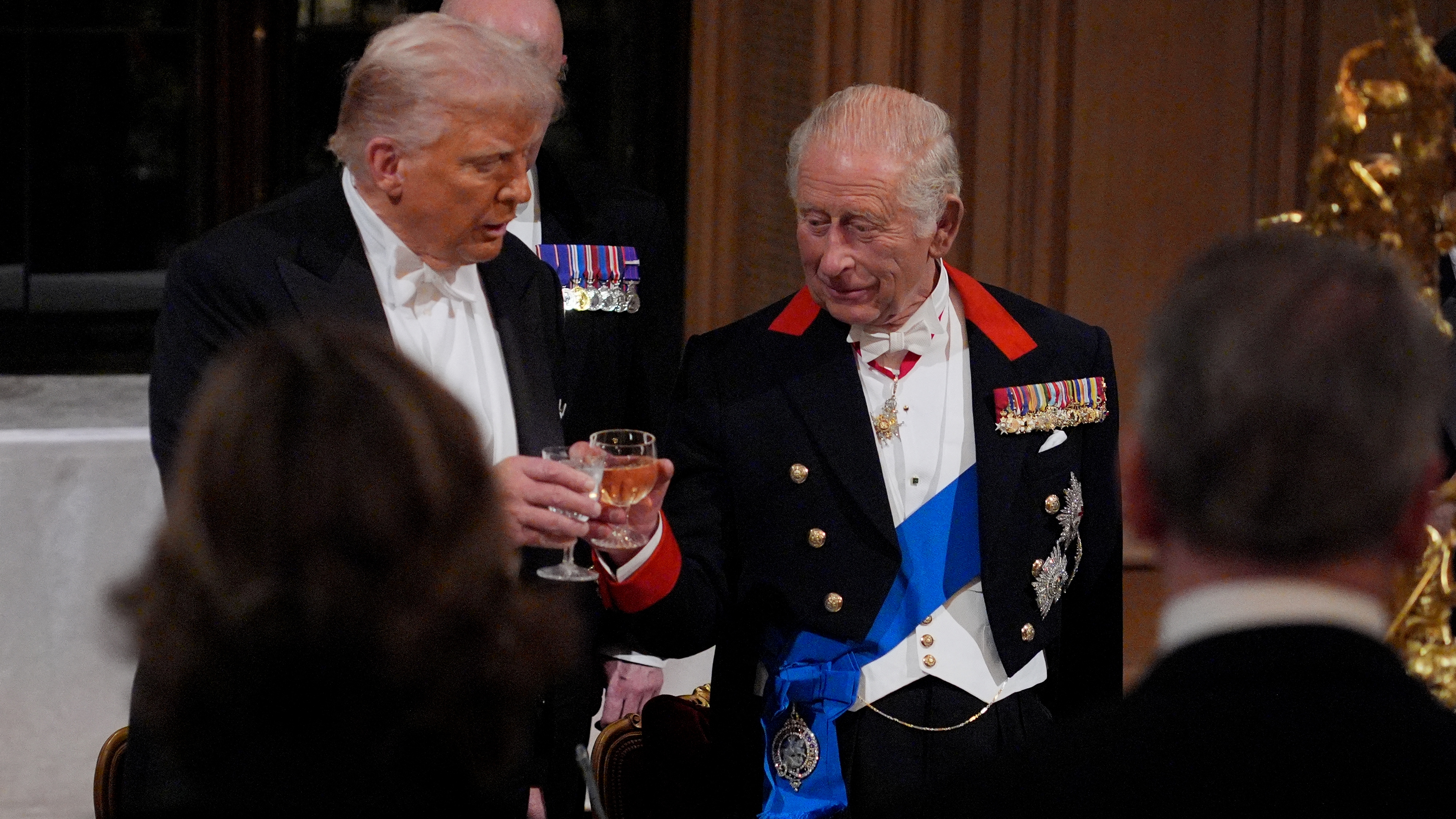 US President Donald Trump and Britain&#039;s King Charles III raise their glasses during a State Banquet at Windsor Castle, in Windsor, on September 17, 2025