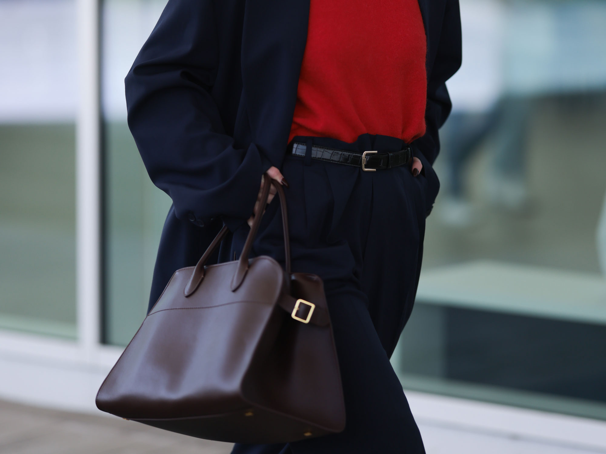 A woman wearing the Margaux bag of the line