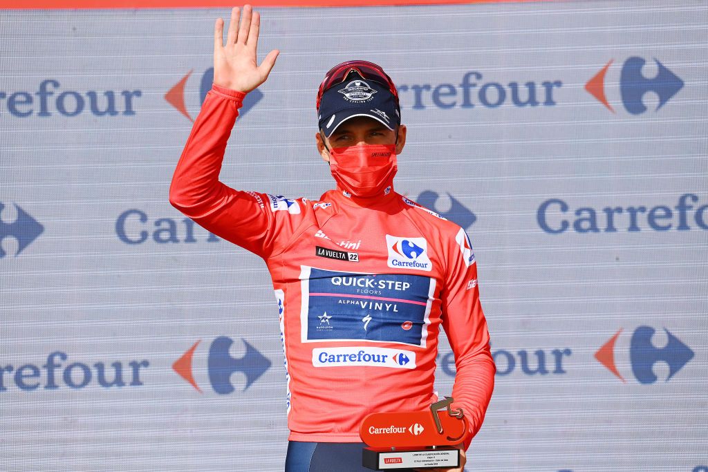 CABO DE GATA SPAIN AUGUST 31 Remco Evenepoel of Belgium and Team QuickStep Alpha Vinyl celebrates winning the Red Leader Jersey on the podium ceremony after the 77th Tour of Spain 2022 Stage 11 a 1912km stage from ElPozo Alimentacin Alhama de Murcia to Cabo de Gata LaVuelta22 WorldTour on August 31 2022 in Cabo de Gata Spain Photo by Tim de WaeleGetty Images