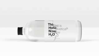 Example of a clean and distorted Helvetica Now on a water bottle