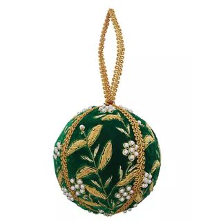 Sudha Pennathur Holiday Ball Ornament against a white background. 