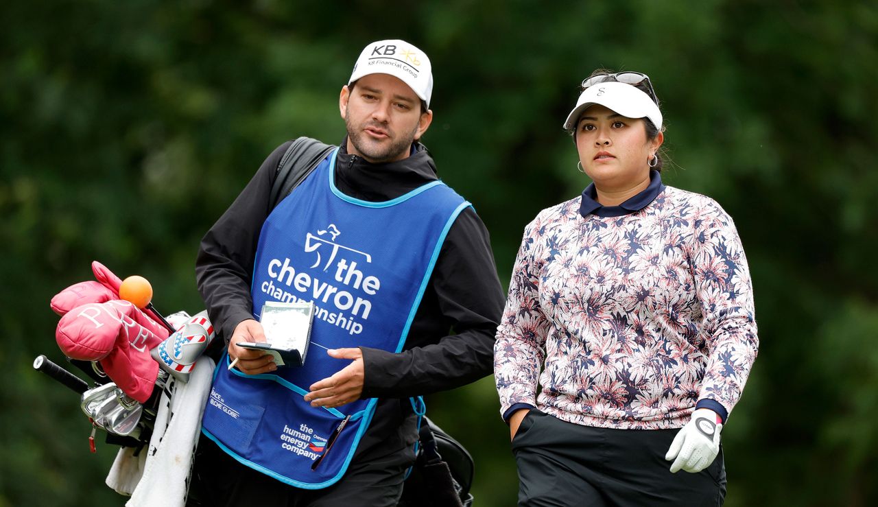 Lilia Vu walks with her caddie