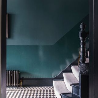 hallway wall decor ideas, blue hallway with gloss and matt walls, black and white floor tiles, black woodwork, carpet runner