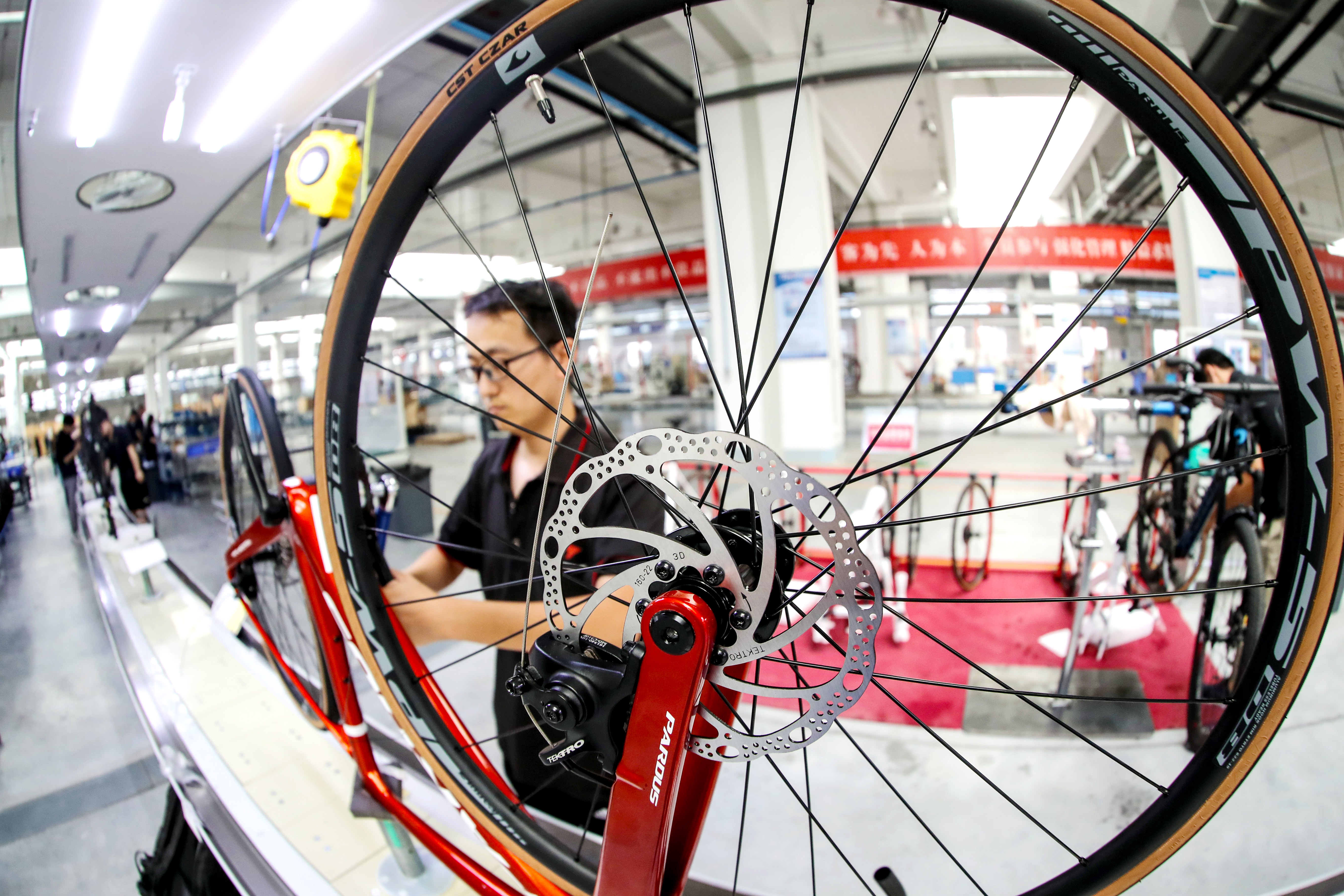 LELING, CHINA - SEPTEMBER 9,2023 - A quality inspector inspects a bicycle at the assembly line at a company's carbon fiber bicycle production workshop in Leling city, Shandong province, China, September 9, 2023.