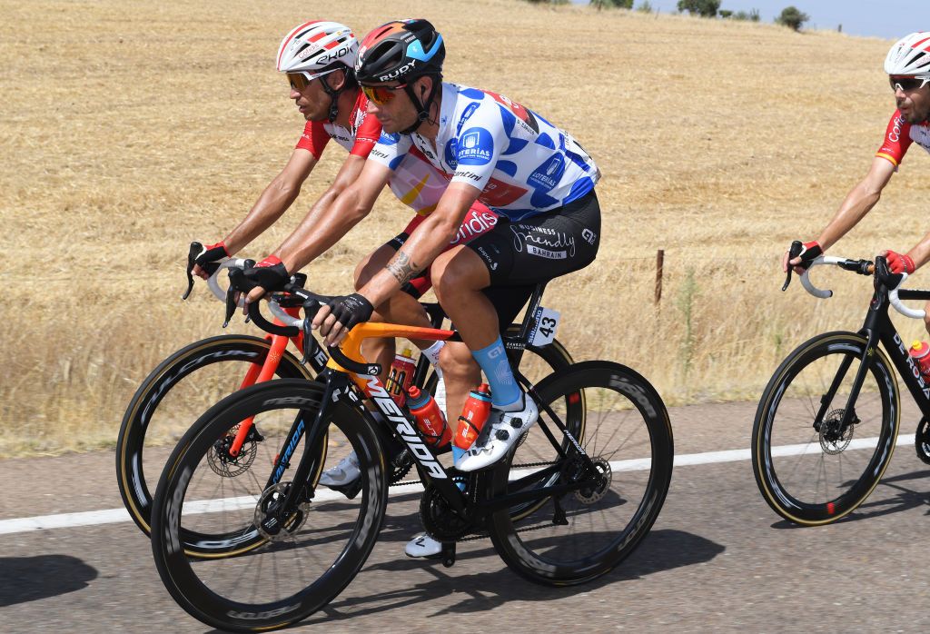 VILLANUEVA DE LA SERENA SPAIN AUGUST 27 LR Jos Herrada Lopez of Spain and Team Cofidis and Damiano Caruso of Italy and Team Bahrain Victorious polka dot mountain jersey compete during the 76th Tour of Spain 2021 Stage 13 a 2037km stage from Belmez to Villanueva de la Serena lavuelta LaVuelta21 on August 27 2021 in Villanueva de la Serena Spain Photo by Tim de WaeleGetty Images