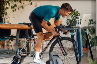 Image shows rider training indoors.