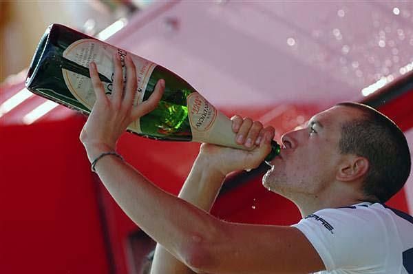 Anthony Roux (Fran&ccedil;aise des Jeux) samples his winner's champagne.