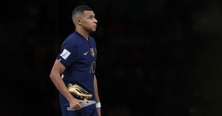 Manchester United target and PSG forward Kylian Mbappe of France poses for a photo with the adidas Golden Boot during the FIFA World Cup Qatar 2022 Final match between Argentina and France at Lusail Stadium on December 18, 2022 in Lusail City, Qatar.