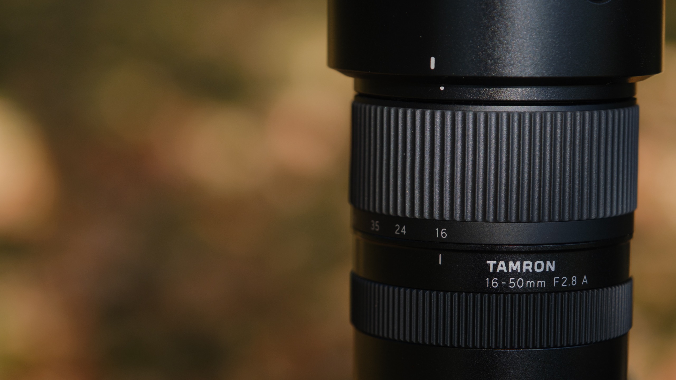 The Tamron 16-50mm f/2.8 A lens photographed outdoors