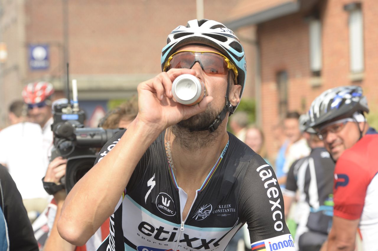 Boonen takes on some refreshment after the stage