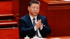 Chinese President Xi Jinping applauds during a plenary session of China's National People's Congress in Beijing on March 9, 2026