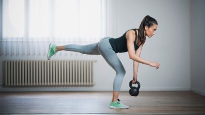 a photo of a woman doing a single-leg deadlift