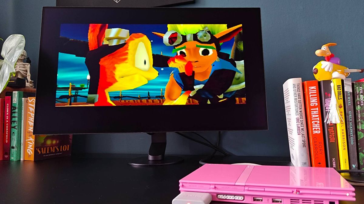 Sony Inzone M10S II with Jak and Daxter cutscene and stretched aspect ratio running on pink PS2 slim.