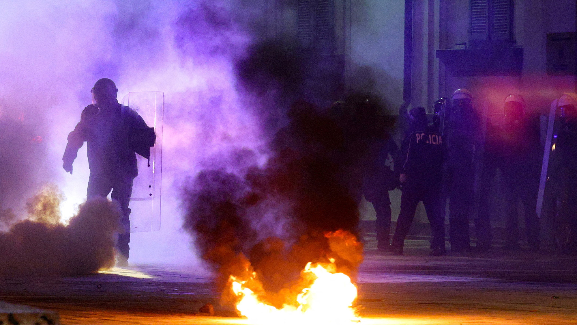 Police officers operate during an anti-government protest, triggered by a corruption investigation against high government officials, in Tirana, Albania