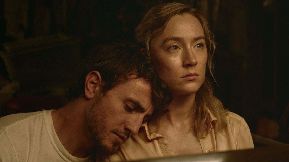 Paul Mescal resting his head on Saoirse Ronan&#039;s shoulder in Foe.