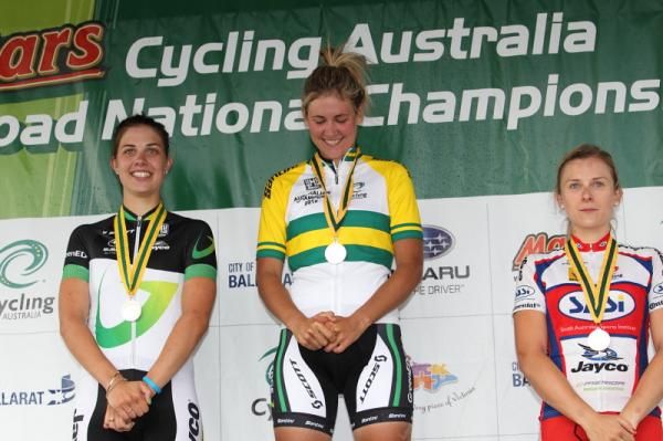 A glance down at the jersey and medal raise a smile from newly-crowned Champion, Alexis Rhodes (GreenEDGE).